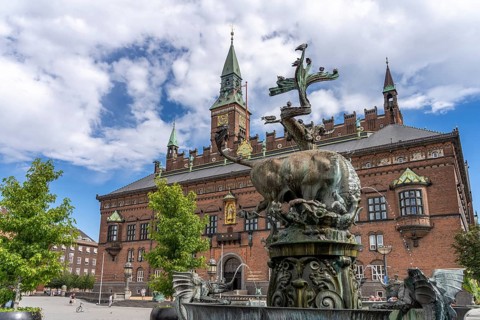 The Dragespringvand dragon fountain and Copenhagen City Hall, Copenhagen, Denmark