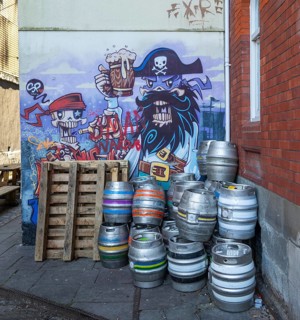 Beer barrels and pirate mural on wall of Seven Stars Inn pub, Redcliffe, Bristol, England, UK