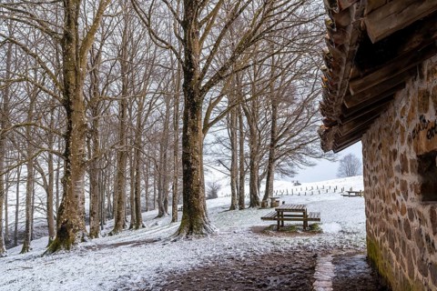Landscape next to the refuge enter the ascent to Mount Aizkorri in Gipuzkoa. Snowy landscape by