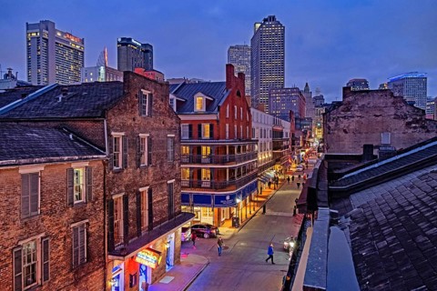 Shops, bars and restaurants at night in Bourbon Street, French Quarter, Vieux Carré in the city New