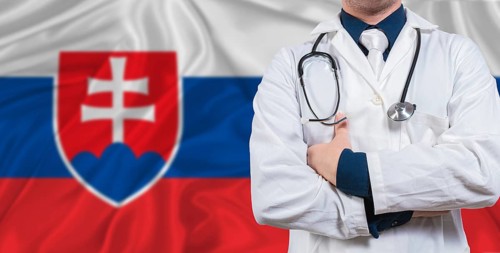Male doctor with stethoscope on Slovakian flag. Doctor holding stethoscope on Slovakian flag