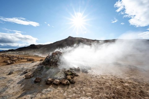 Steaming fumarole, solfatar in the geothermal area Hverarönd, also Hverir or Namaskard, Sun Star,