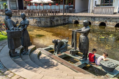 Sculpture Washerwomen at the Warm Pader in Paderborn, North Rhine-Westphalia, Germany