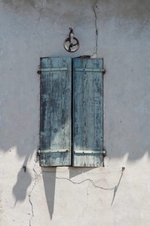 Window with closed blue shutters, Provence, France