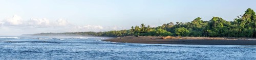 Coastal landscape, sea and sandy beach with rainforest, Corcovado National Park, Osa Peninsula,