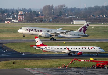 Düsseldorf Airport, Austrian aircraft on the taxiway and Qatar Airways Boeing 787 Dreamliner, on