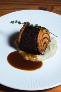 Cinnamon roll meets the intensity of slow-cooked oxtail, enriched with aromatic herbs. A delightful