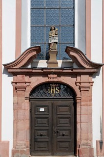 Entrance portal of the parish church of St. John the Baptist, built in 1475 as a Gothic church,