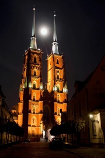 St. John the Baptist Cathedral at night, moon between the church towers in Wroclaw, Poland