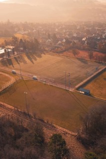View from above of a sports field and an adjacent settlement, Gechingen, Calw district, Germany