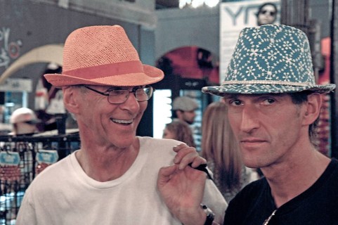 Young men poke hats for fun in a department store, New York, USA