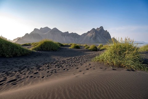 Black beach with volcanic sand, sandy beach, dunes with grass, Stokksnes headland, Klifatindur