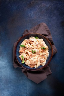 Papardelle pasta, with chanterelle mushrooms, in cream sauce, homemade, no people