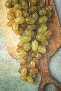 A branch of white grapes, wine grapes, Georgian grape variety Rkatsiteli, top view