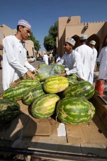 Watermelons for sale in the souk or soug or market in the old town of Nizwa, ad-Dachiliyya region,
