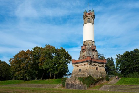 Impressive historic tower in a park with trees and blue sky, Harkortturm, Wetter an der Ruhr, North