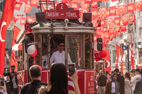 Istanbul, Turkey. October 29th 2023 Crowds flock between the many flags in Istiklal Street,