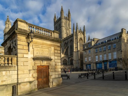 Abbey church and churchyard from corner of Roman Baths, Bath, Somerset, England, UK