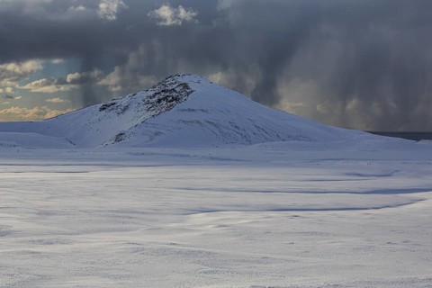 Cloudy mood and snowstorm over an old volcano, snow, winter, Neshraun, Snaefellsnes, Vesturland,
