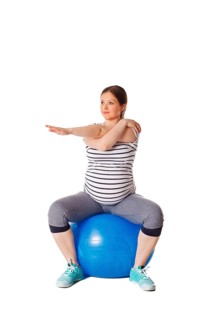 Pregnancy exercise concept, pregnant woman doing stretching exercises with exercise ball isolated