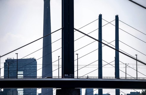 Oberkassler bridge over the Rhine near Düsseldorf, in front, behind the Rheinknie bridge, city