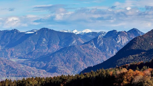Mountain panorama with snow-covered peaks and autumnal forest in the Alps, Hocheck