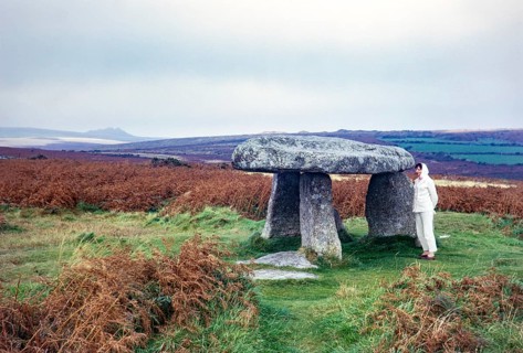 Woman in front of the prehistoric dolmen Lanyon Quoit, Morvah, Cornwall, England, UK 1967