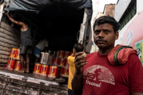 GUWAHATI, INDIA - MAY 1: Labourers carries goods in a wholesale market, in Guwahati, India, on May
