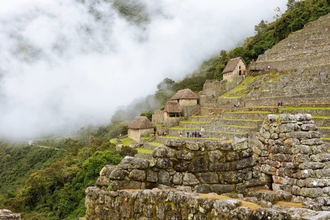 Inca ruins of Machu Picchu in the clouds, Cusco region, Peru