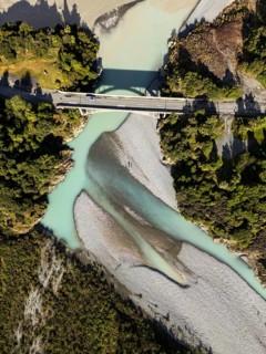 Aerial view showcases the serene river landscape of Canterbury, New Zealand, highlighting its clear