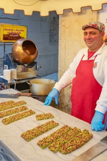 Person making traditional nougat, Ortygia, Syracuse, Sicily, Italy