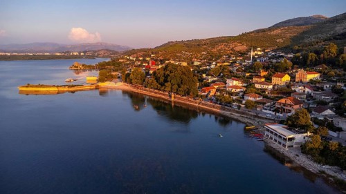 Aerial drone view of Shiroka Lake at sunset near Shkoder. Albania