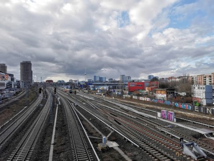 Extensive railway area with city views and cloudy skies, Berlin