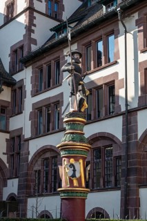 The Sevogelbrunnen on Martinskirchplatz in the old town of Basel with the statue of a warrior from