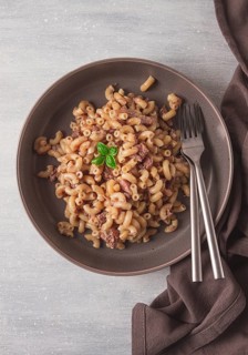 Pasta with stewed meat, pasta in the navy, horns, homemade, no people