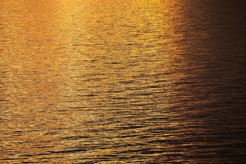 Sun rays are reflected on the sea surface, small waves, Baltic Sea