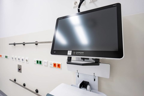 Modern medical monitor on a beige-colored wall in a room, operating room in the new Calw hospital,