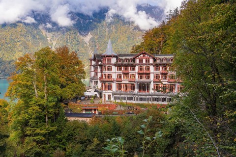 Historic hotel in an impressive mountain landscape surrounded by autumnal trees, Grandhotel