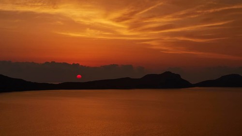 A dramatic red sunset, the landscape appears in backlight, Navarino Bay, Pylos, Peloponnese, Greece