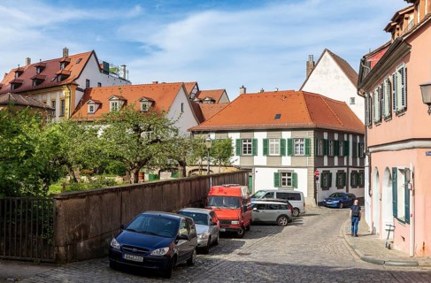 Small orchard between narrow houses, mountain town of Bamberg, Bavaria, Germany