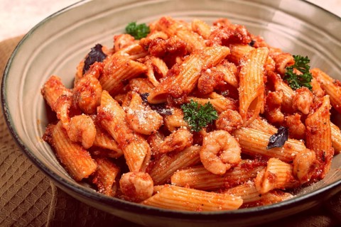 Penne pasta, with shrimp in tomato sauce, close-up, no people
