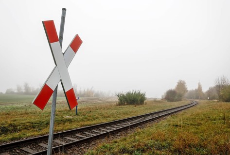 A St Andrew's cross stands at a level crossing of a branch line of the railway near Neugarten, 06