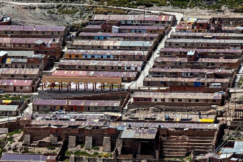 Densely built townhouses with different colored roofs in an urban environment, The silver mines of