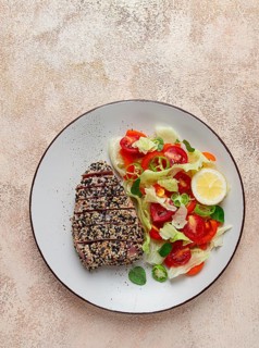Fillet of red tuna meat, fried in sesame seeds, homemade, close-up, no people, on a wooden