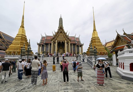 Tourists at Wat Phra Kaew, Temple of the Emerald Buddha, Bangkok, Thailand