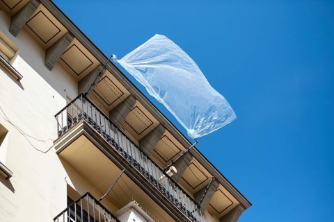 A plastic sheet flutters in the wind on a house in the Barcelonata neighbourhood, Spain