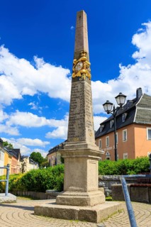 Postal pillar in the market square of Zwönitz, Erzgebirge, Saxony, Germany