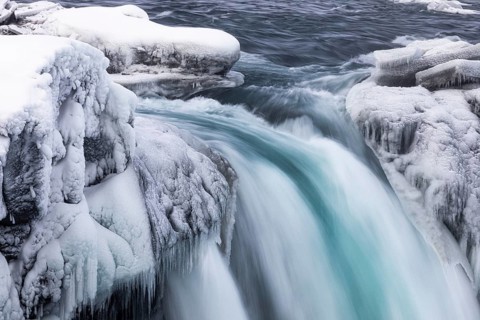 Godafoss waterfall, icy and snowy rock face, Northern Iceland Eyestra, Iceland