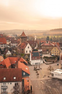 Foggy city view with half-timbered houses and a church in rural surroundings, Ötisheim, Enzkreis,