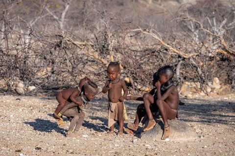 Himba children playing, traditional Himba village, Kaokoveld, Kunene, Namibia